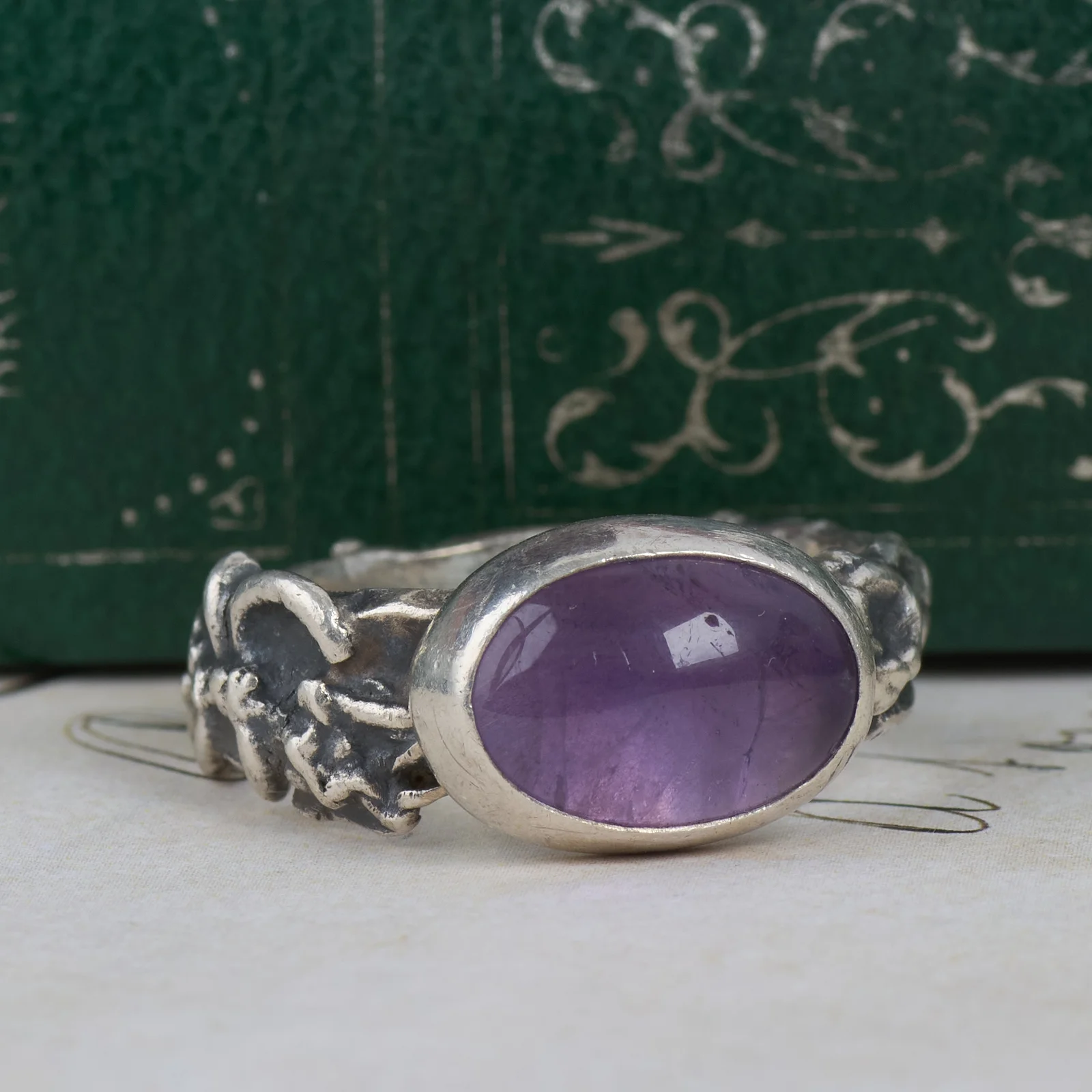 260903C-003 — 260903C-003-8.webp Silver Amethyst Ring Oval Cabochon Purple Stone Floral Shoulders Chunky Band