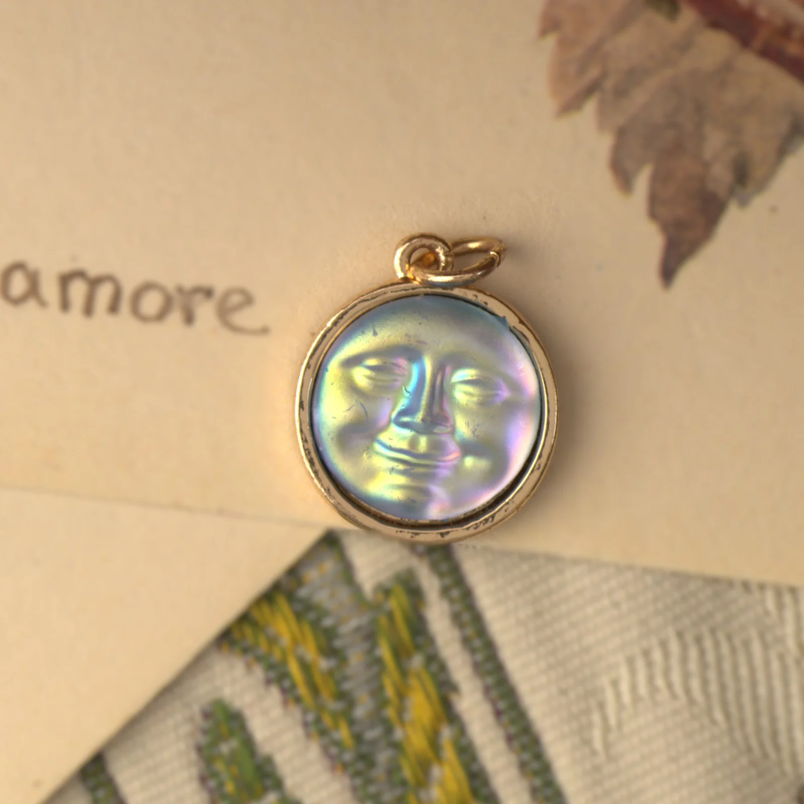 260929C-010 — 260929C-010-2.webp Moon Face Pendant Charm Iridescent Blue Celestial Gold Tone