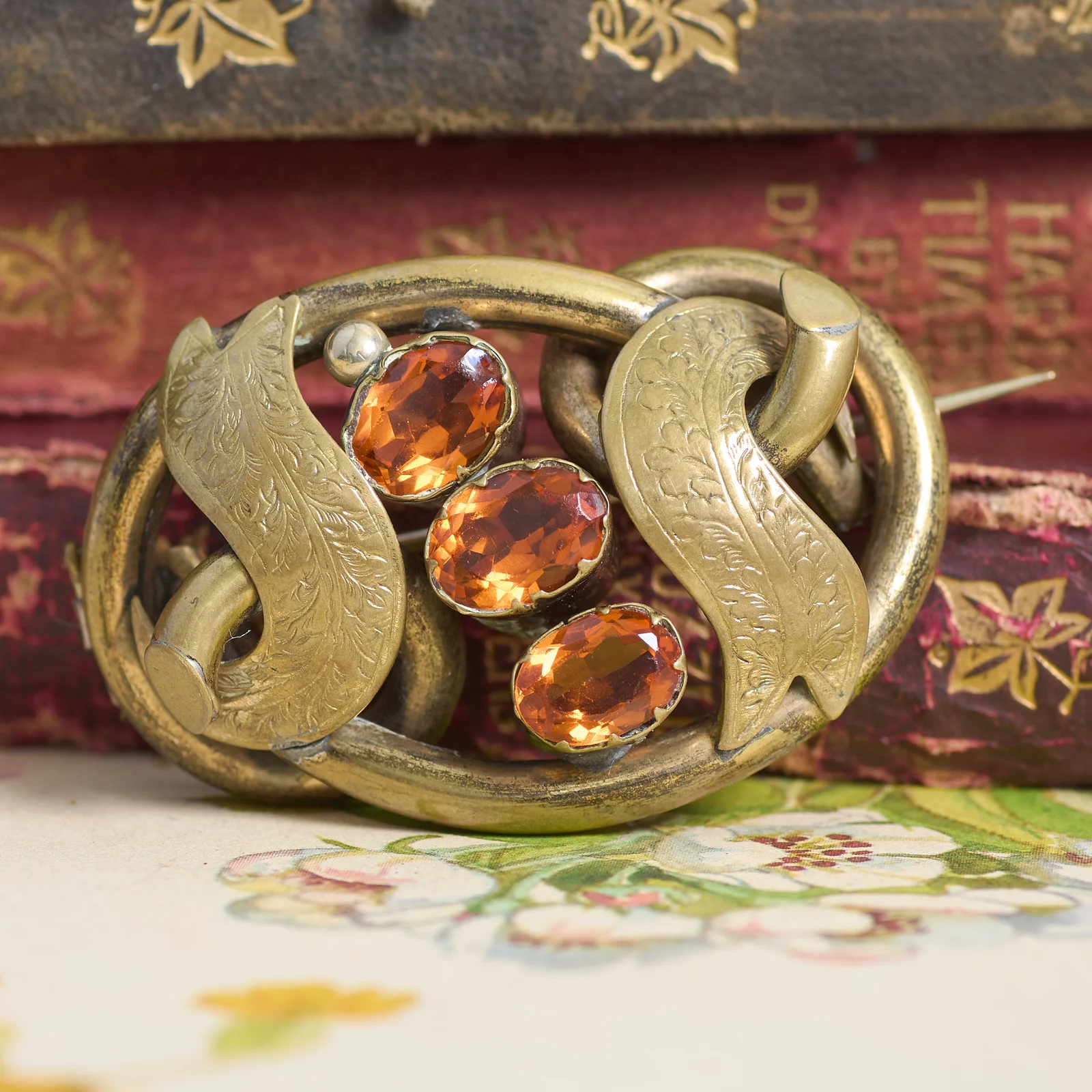 260929E-008 — 260929E-008-5.webp Antique Lovers Knot Victorian Glass Pinchbeck Etched Gold Tone Brooch